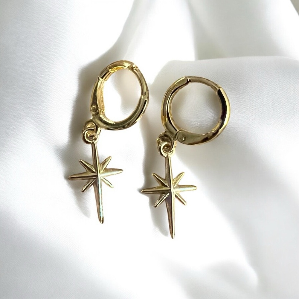 gold starburst huggie hoop earrings